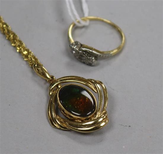 An 18ct gold and three stone diamond ring and an 18ct gold pendant on chain.